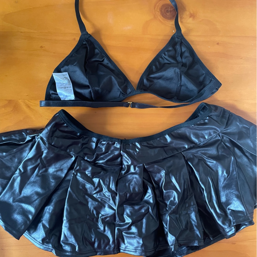 NWOT 2 piece bralette and mini skirt. Black sheen. Size small